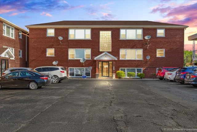 a car parked in front of a brick building