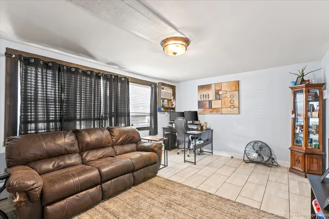 a living room with furniture and a table