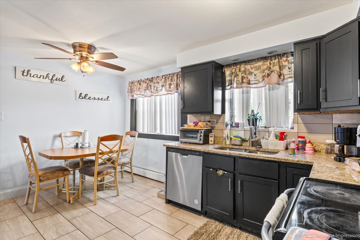 7110 West 107th Street, Unit 16 Worth, IL 60482 - Photo 10 of 12 a kitchen with a dining table chairs and a refrigerator