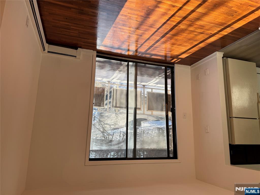 107 Bellgrove Drive, Unit 3B Mahwah, NJ 07430 - Photo 2 of 11 a view of a room with wooden floor and a sink