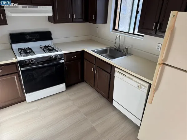 a kitchen with a stove and a microwave