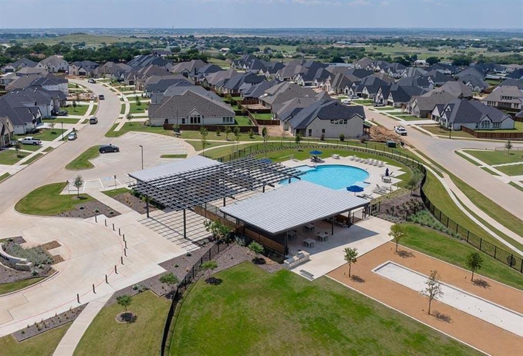 566 Broadleaf Way Haslet, TX 76052 - Photo 37 of 38 The community amenities include a swimming pool, a covered patio area, and a bocce ball court