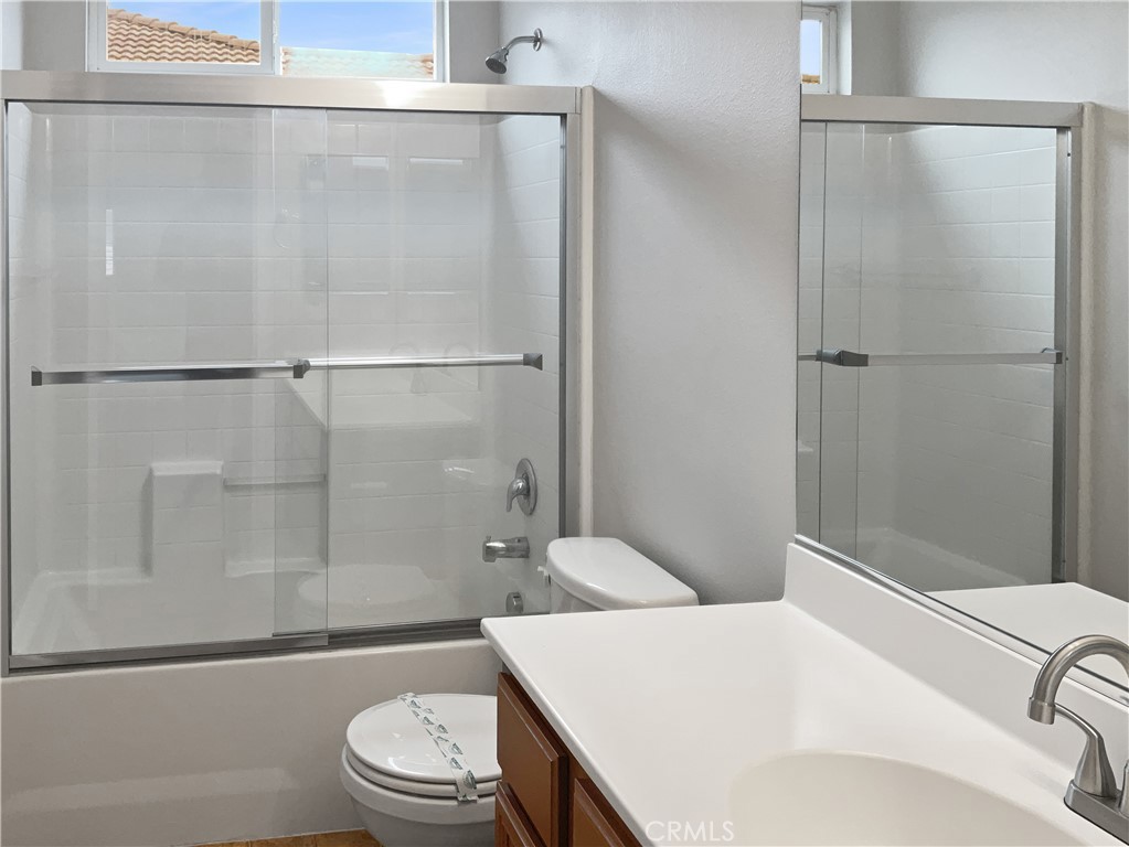 1966 Echo Road San Jacinto, CA 92582 - Photo 19 of 23 a bathroom with a sink a toilet and shower