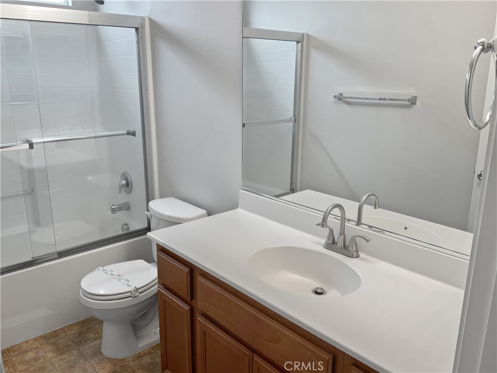 1966 Echo Road San Jacinto, CA 92582 - Photo 20 of 23 a bathroom with a sink a toilet and shower