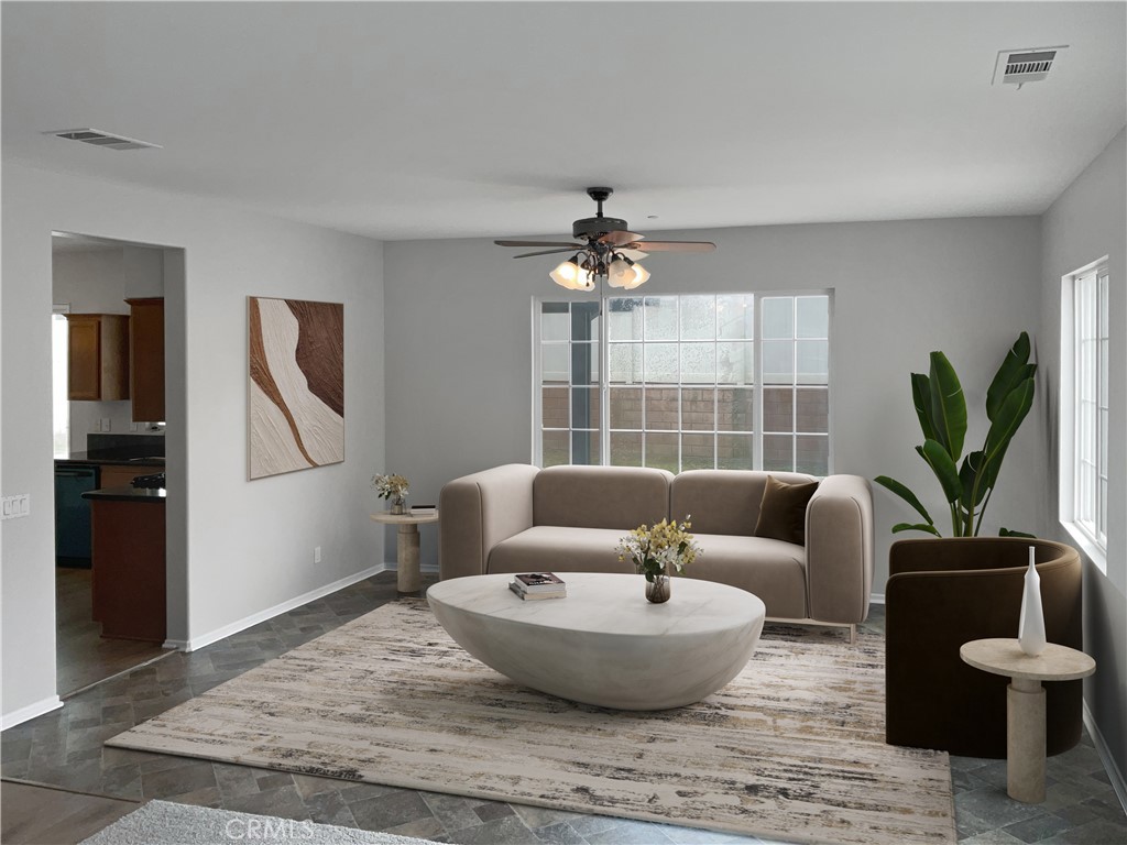 1966 Echo Road San Jacinto, CA 92582 - Photo 2 of 23 a living room with furniture and a potted plant
