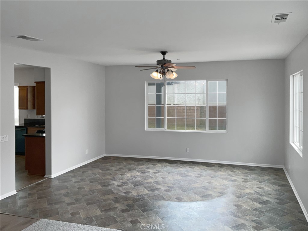1966 Echo Road San Jacinto, CA 92582 - Photo 3 of 23 an empty room with chandelier fan