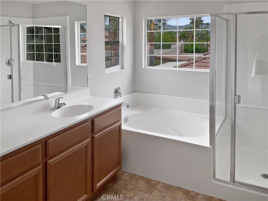 1966 Echo Road San Jacinto, CA 92582 - Photo 7 of 23 a bathroom with a tub sink and a shower