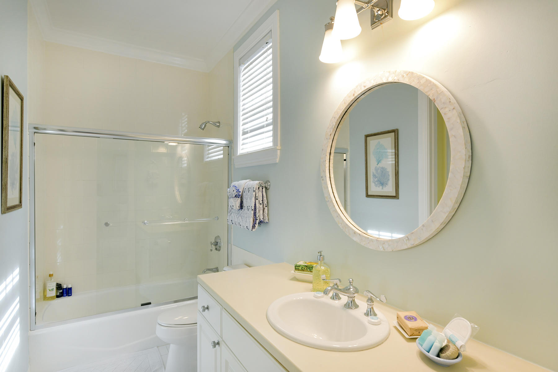 5 Sunset Key Drive Key West, FL 33040 - Photo 27 of 37 a bathroom with a sink a toilet and a mirror