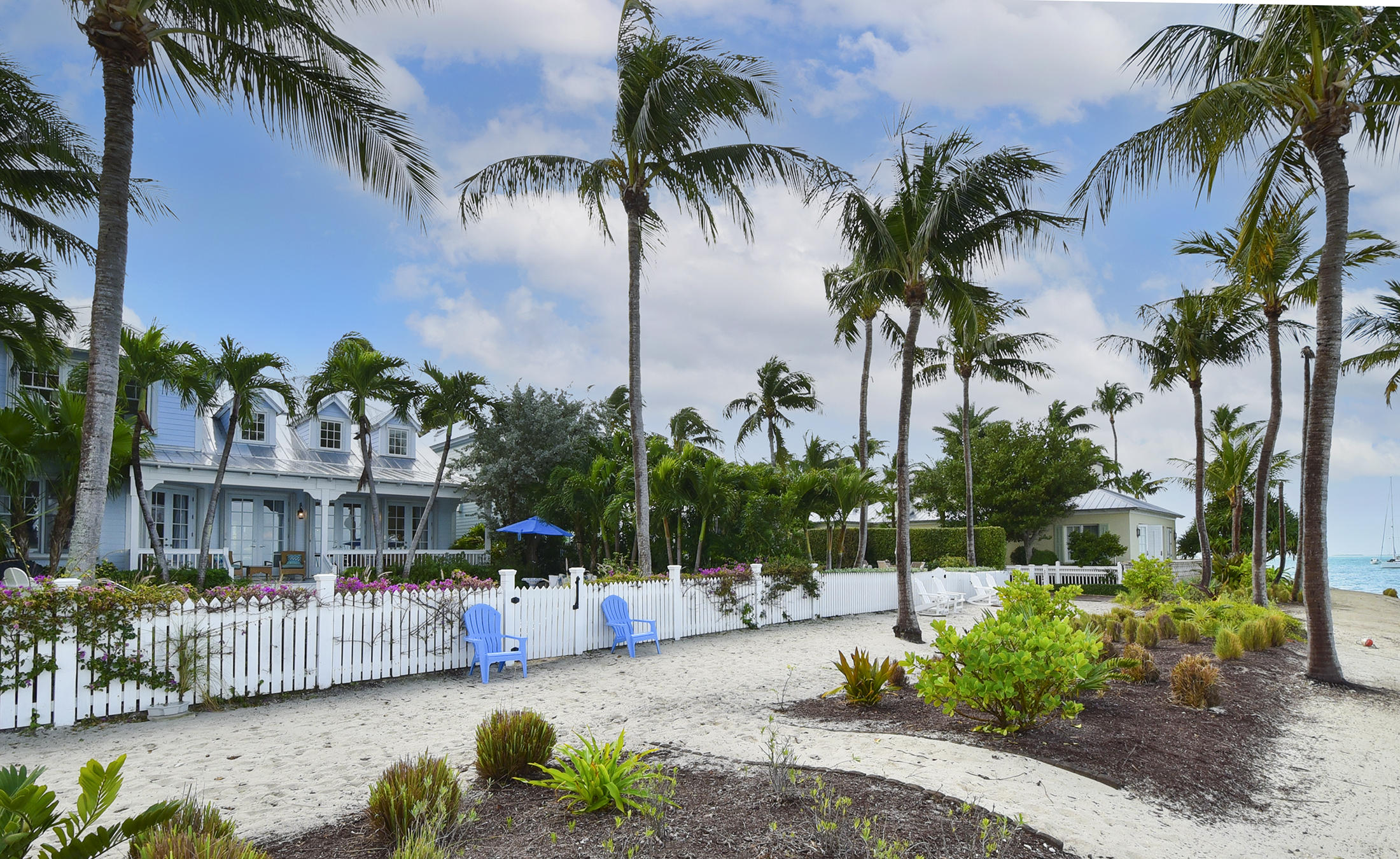 5 Sunset Key Drive Key West, FL 33040 - Photo 6 of 37 a view of a swimming pool with a table and chairs