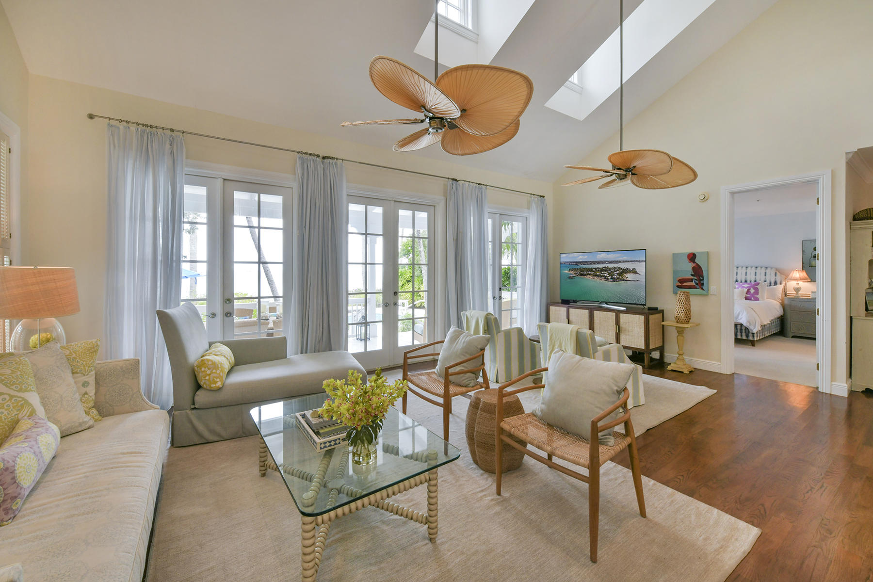 5 Sunset Key Drive Key West, FL 33040 - Photo 10 of 37 a living room with furniture ceiling fan and a large window