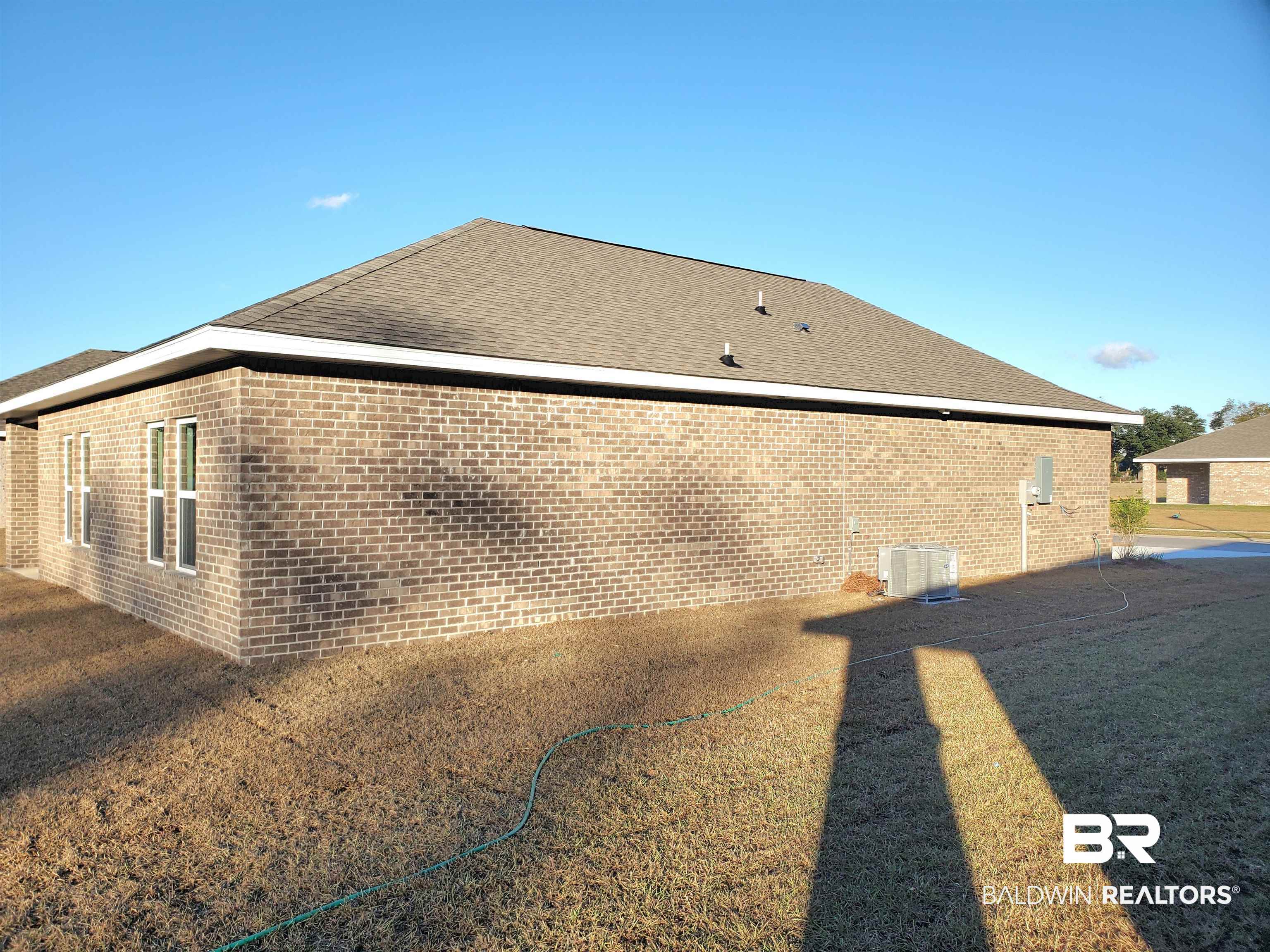 14666 Dayton Circle Foley, AL 36535 - Photo 18 of 21 View of side of home featuring central AC unit