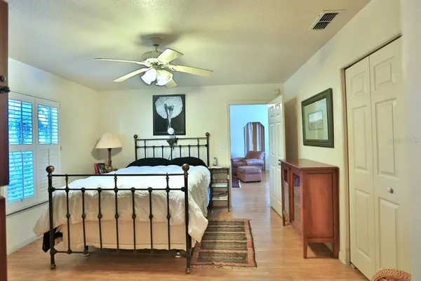 a view of a patio with a table and chairs under an umbrella