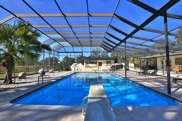 a view of a lake with houses in the back