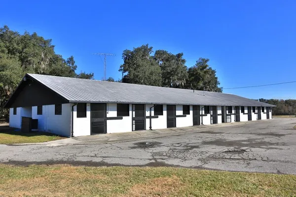 a view of an empty room with a fireplace
