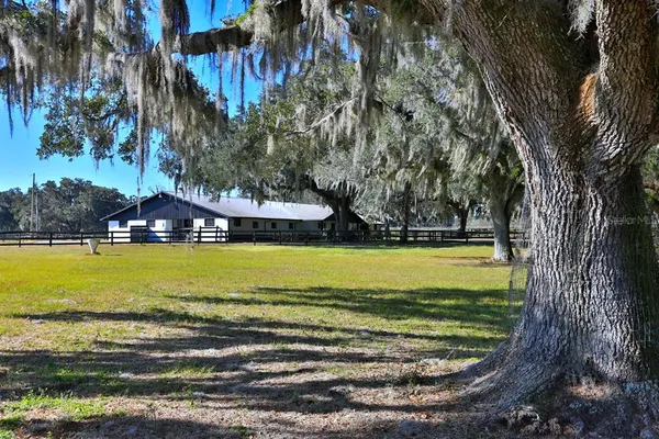 an aerial view of a house with a swimming pool