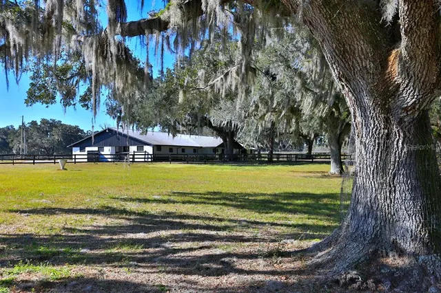an aerial view of a house with a swimming pool