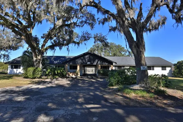 a view of a swimming pool with a yard