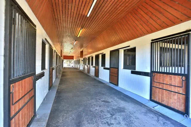 a view of a swimming pool with a yard