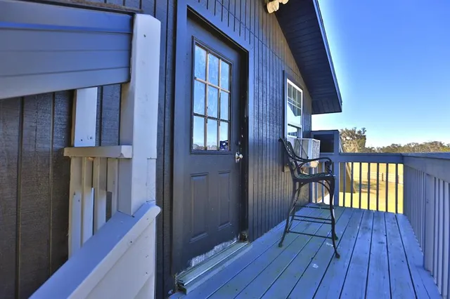 a view of a swimming pool with a yard