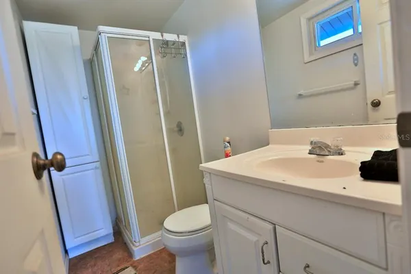 an aerial view of a house with a swimming pool and outdoor seating