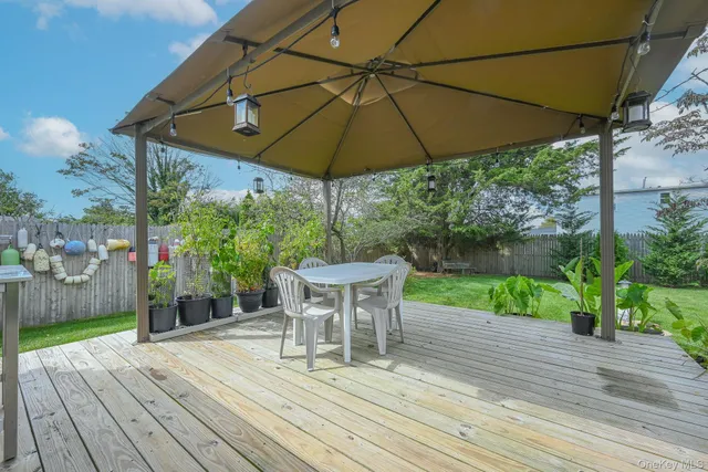 a view of a chair and table on the wooden floor