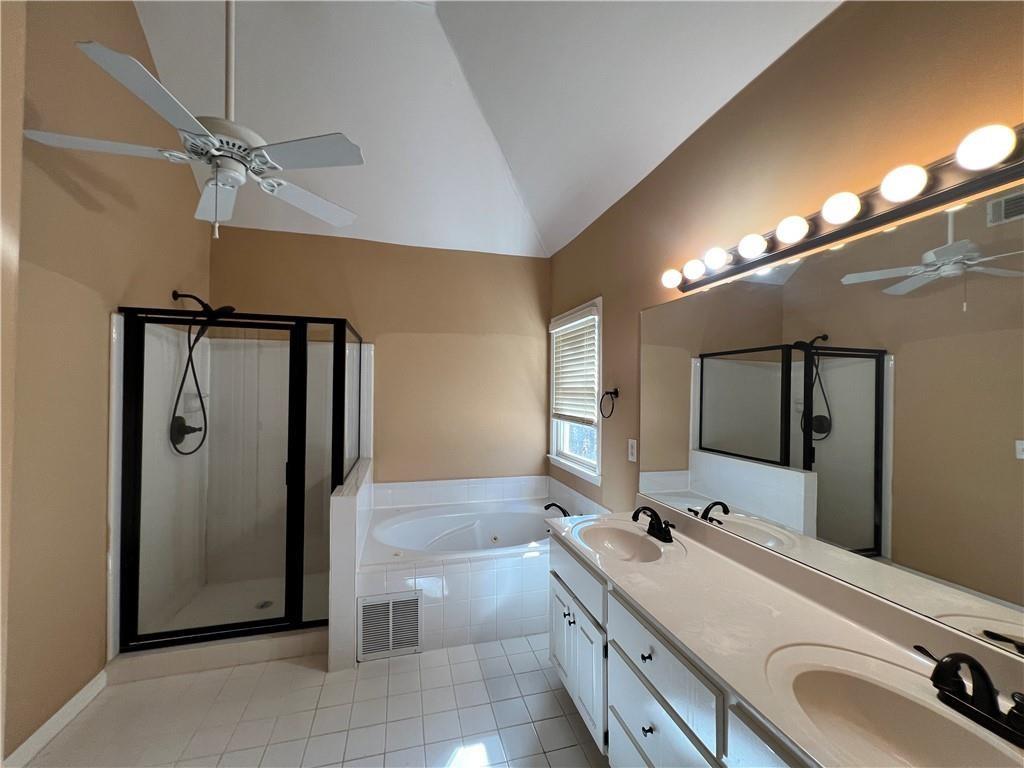 2550 Wellsley Lane Cumming, GA 30041 - Photo 11 of 22 a bathroom with a double vanity sink mirror and shower