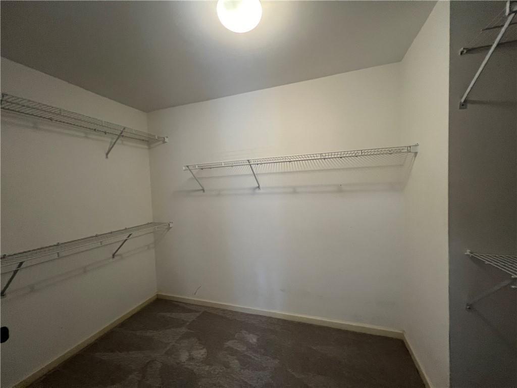 2550 Wellsley Lane Cumming, GA 30041 - Photo 12 of 22 a view of a room with racks on the wall