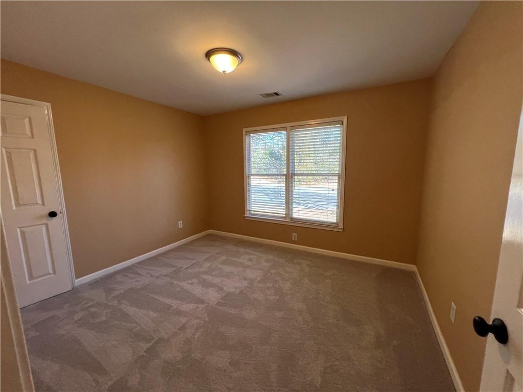 2550 Wellsley Lane Cumming, GA 30041 - Photo 15 of 22 an empty room with windows