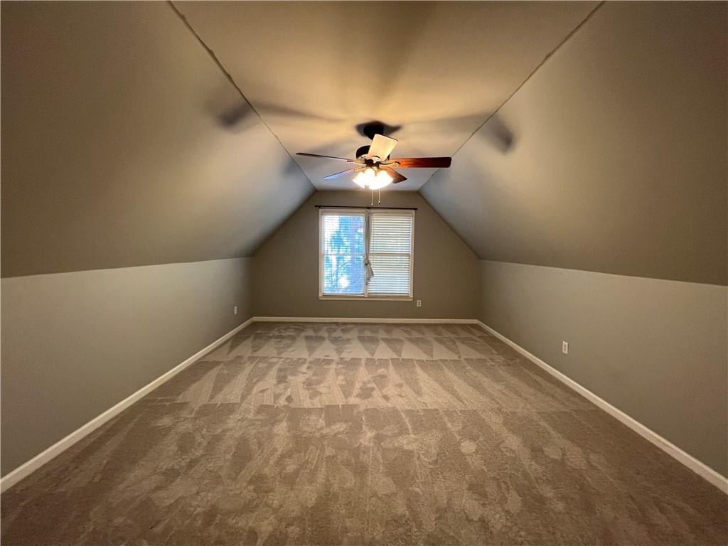 2550 Wellsley Lane Cumming, GA 30041 - Photo 17 of 22 en empty room with windows and ceiling fan