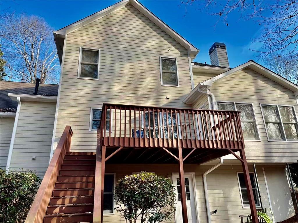 2550 Wellsley Lane Cumming, GA 30041 - Photo 21 of 22 a view of a house with a deck