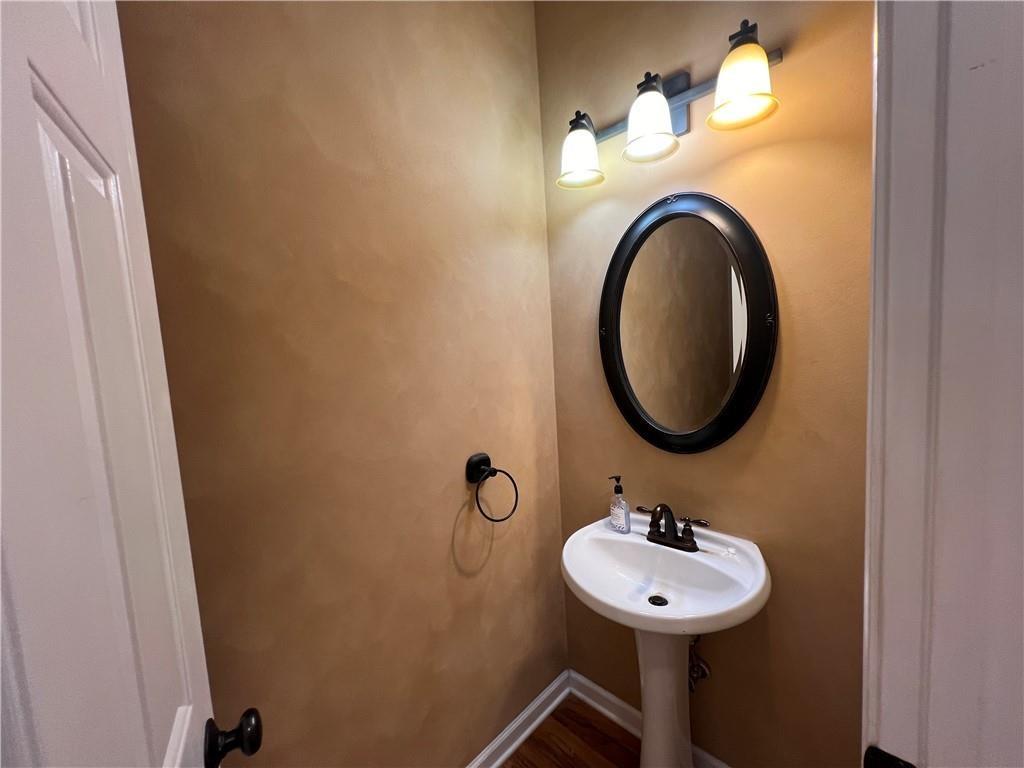 2550 Wellsley Lane Cumming, GA 30041 - Photo 9 of 22 a bathroom with a sink and a mirror