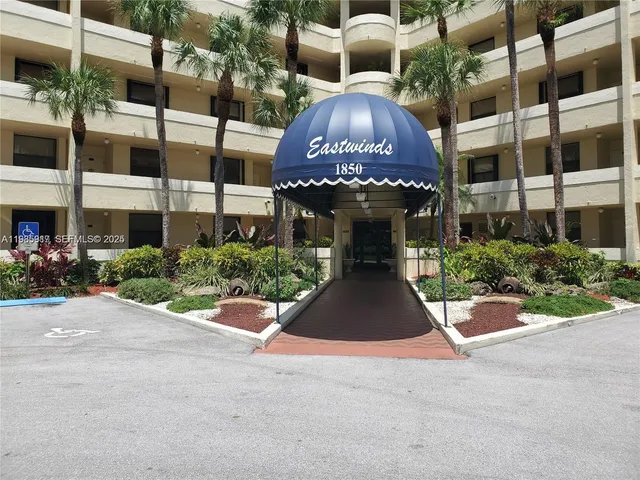 a front view of building with yard