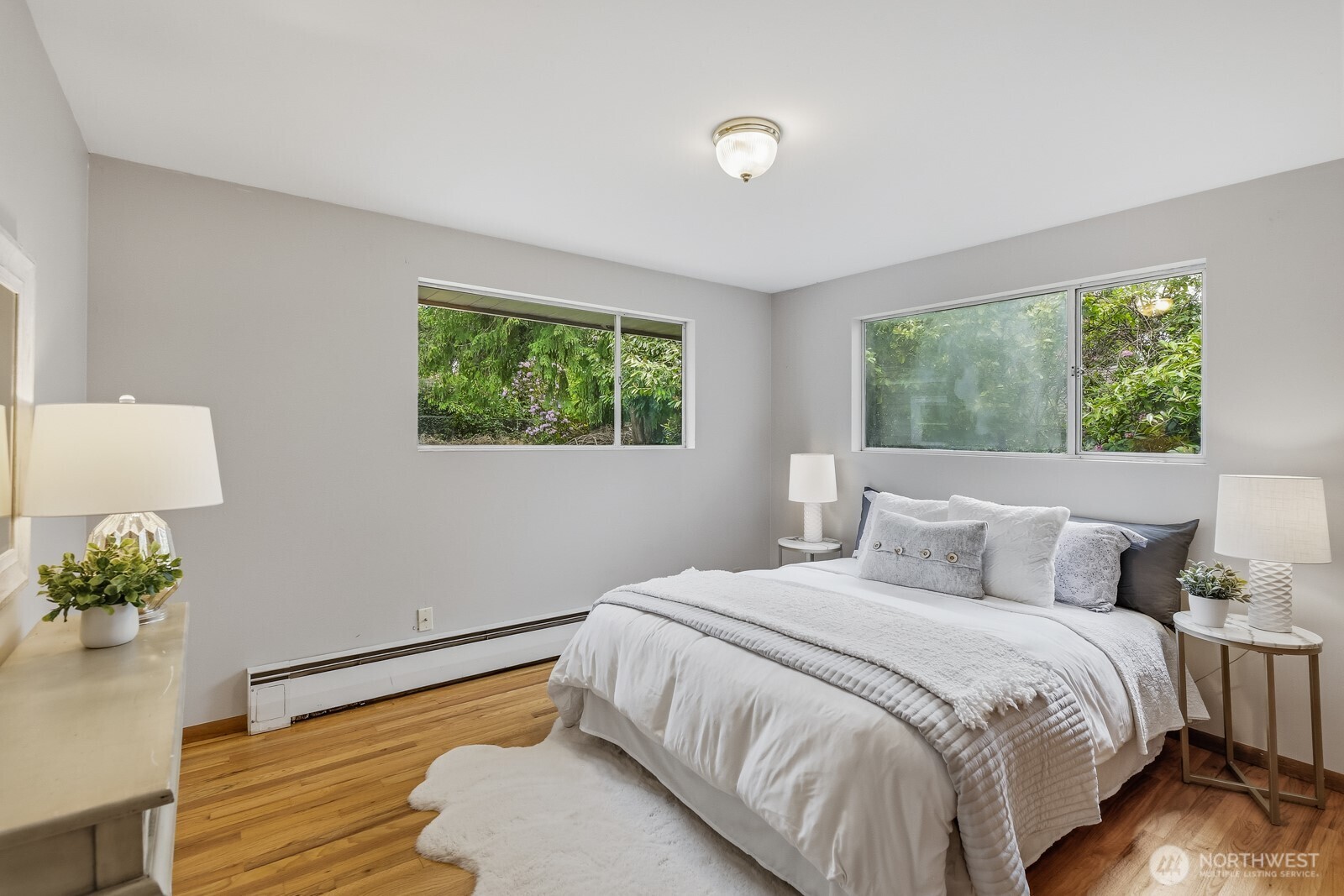 3822 Shelby Road Lynnwood, WA 98087 - Photo 20 of 40 a bedroom with a bed and a potted plant