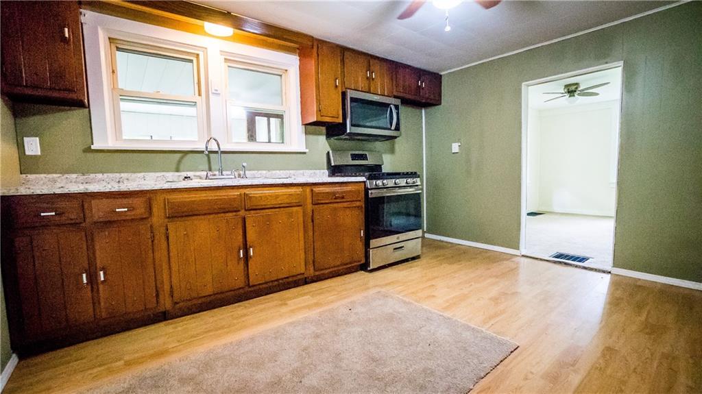 118 Dunkle Road Parker, PA 16049 - Photo 11 of 19 Matching Stove/Microwave Combo and Abundant Cabinetry