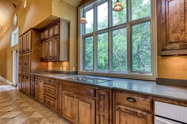 a kitchen with stainless steel appliances granite countertop a stove and a sink