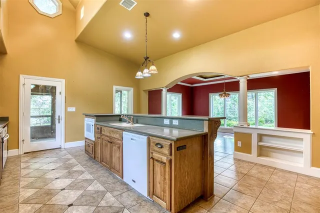 a kitchen that has a lot of cabinets in it