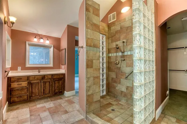 a bathroom with a bathtub and a sink