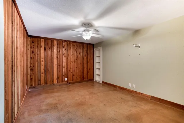 a view of a street with a tree