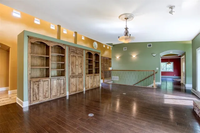 a view of a house with wooden floor windows and a fireplace