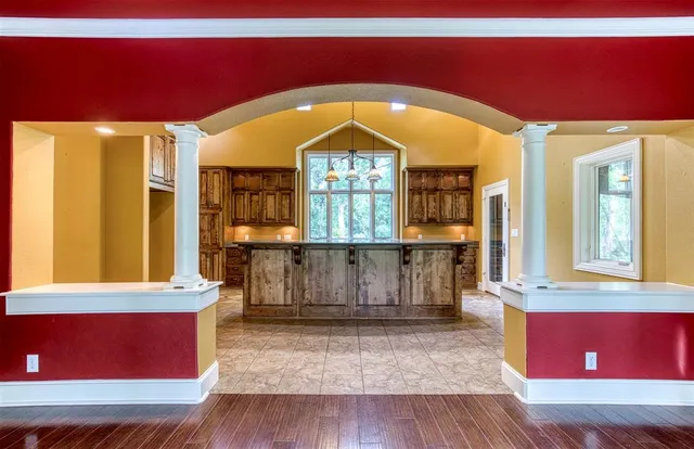 a view of hall way with furniture