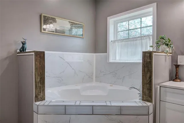 a bathroom with a sink mirror vanity and toilet