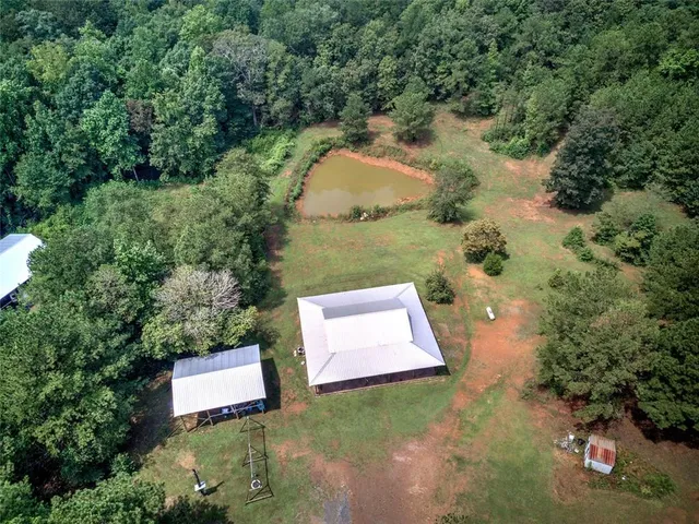 a view of a yard with large trees