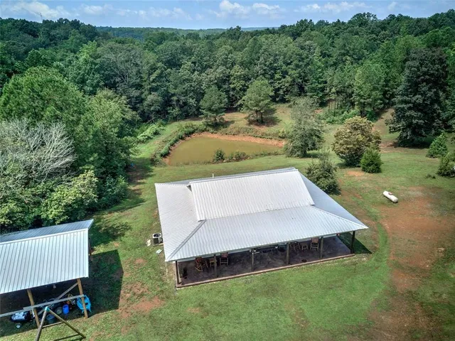 a view of a road with a trees in the background