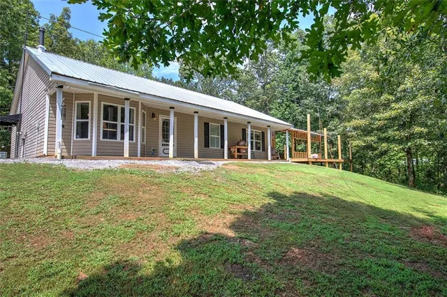 a backyard of a house with lots of green space