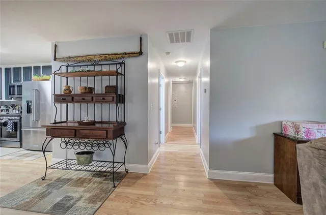 a view of a park with large trees