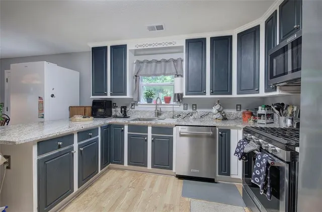 a backyard of a house with a yard and outdoor seating