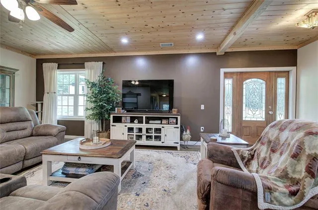 a kitchen with stainless steel appliances a refrigerator sink and cabinets