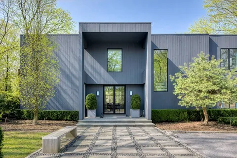 a front view of a house with garden