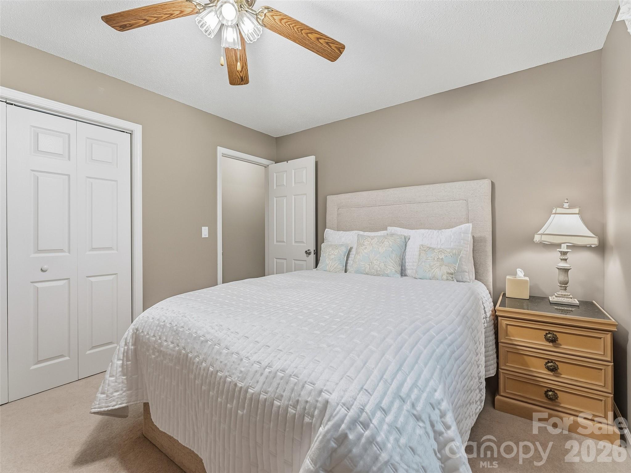 1340 Macedonia Road Saluda, NC 28773 - Photo 29 of 45 a bedroom with a bed and cabinet
