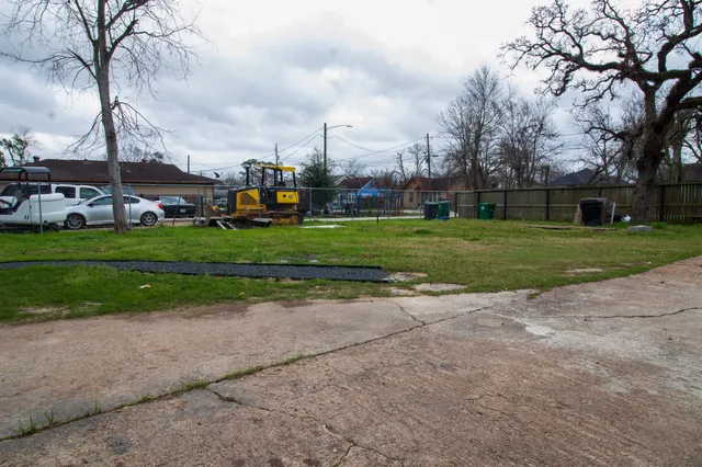 a childrens park with lots of trees and buildings